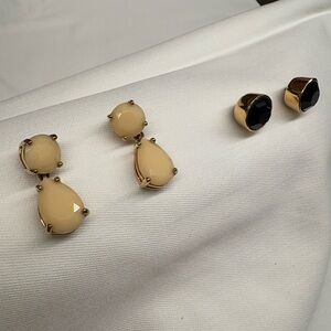 2 pair of Kate Spade earrings. Ivory drop style and rich brown bold studs.